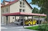 Skan Holz Doppelcarport Wendland 630x879 cm 216 cm Einfahrtshöhe mit EPDM-Dach rote Blende Schiefergrau