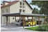 Skan Holz Doppelcarport Wendland schwarze Blende inkl. Pfostenanker 630 x 879 cm nussbaum