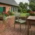 CLP Joliya Gartenstuhl stapelbar mit Armlehnen, Kunststoff, oliv (326989)
