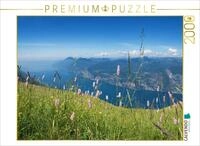 Puzzle &middot; Gardasee Blick Monte Baldo 2000 Teile Puzzle quer | Wildblumenwiese am