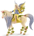 Schleich Spielzeugfigur Sera mit Bl&uuml;ten-Einhorn.