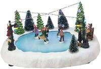 Spetebo LED Weihnachtszene - Eisbahn mit fahrenden Figuren - Tischdekoration