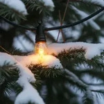 Stimmungsvolle Lichterkette mit 10 Flammen-Gl&uuml;hbirnen, 5,1m &ndash; IP44,...