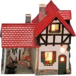 Wurm - Lichthaus Teelicht Haus Schmiede aus Porzellan, B16 x T8 x H16 cm - Bunt