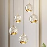 Lucande LED-Pendellampe Hayley, &Oslash; 30 cm, 5-flg., gold, Glas